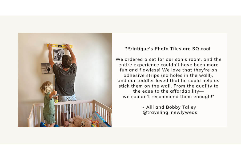 child and father hanging up photo tiles